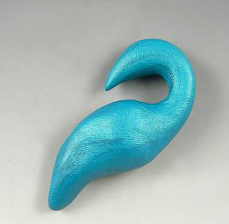 Blue clay in a vague peacock shape